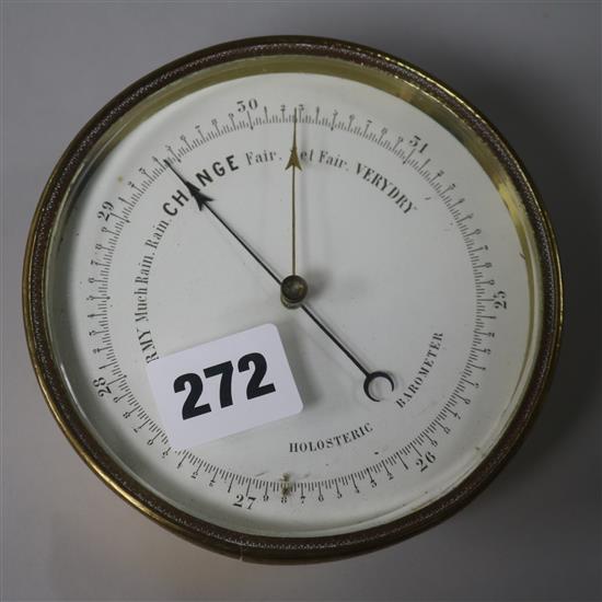 A small brass aneroid barometer